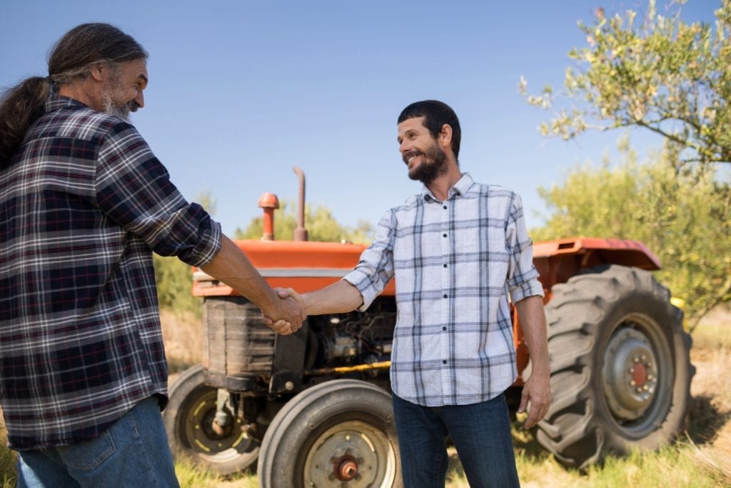 distribution partners, hemp farmers, selling hemp and CBD products, hemp industry, Happy affiliates shaking hands in Hemp & CBD farm